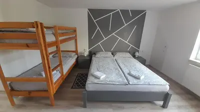 Łóżko lub łóżka w pokoju w obiekcie Apartament 