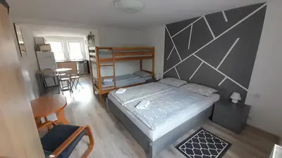 Łóżko lub łóżka w pokoju w obiekcie Apartament 