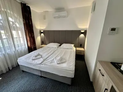 Łóżko lub łóżka w pokoju w obiekcie Villa Stary Kalisz