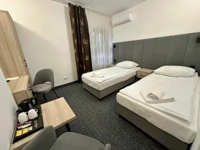 Łóżko lub łóżka w pokoju w obiekcie Villa Stary Kalisz