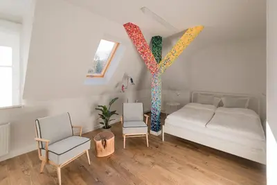 Łóżko lub łóżka w pokoju w obiekcie Kolorowe Pola Boutique B&B