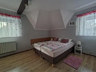 Łóżko lub łóżka w pokoju w obiekcie Jaskółka