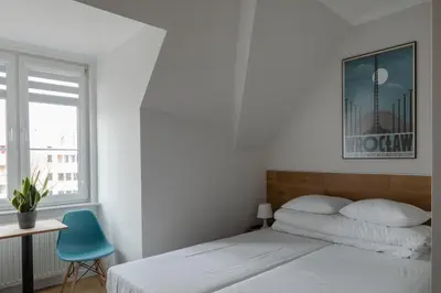 Łóżko lub łóżka w pokoju w obiekcie MoHo XL