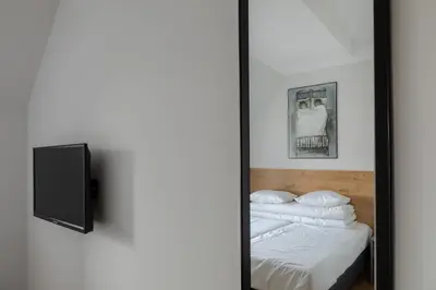 Łóżko lub łóżka w pokoju w obiekcie MoHo XL