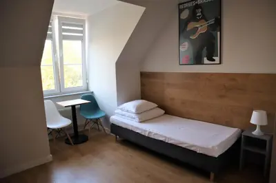 Łóżko lub łóżka w pokoju w obiekcie MoHo XL