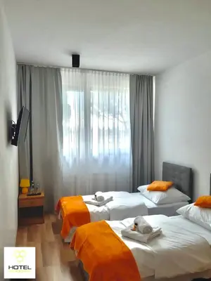 Łóżko lub łóżka w pokoju w obiekcie Hotel Miodowy