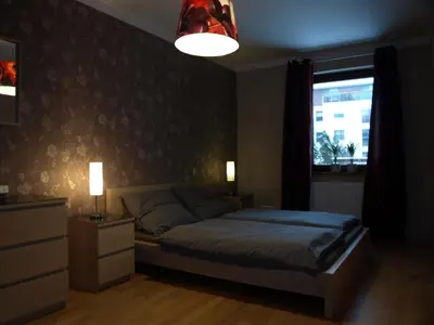 Łóżko lub łóżka w pokoju w obiekcie Apartament przy parku