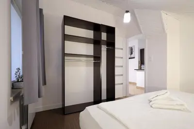 Łóżko lub łóżka w pokoju w obiekcie Dworek Różany Hotel & Restauracja