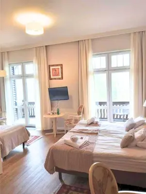 Łóżko lub łóżka w pokoju w obiekcie Villa Lessing