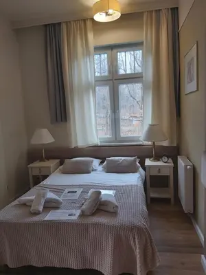 Łóżko lub łóżka w pokoju w obiekcie Villa Lessing
