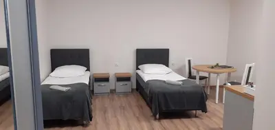 Łóżko lub łóżka w pokoju w obiekcie Hostel Adabet