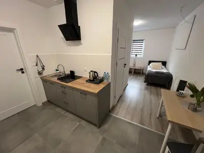 Łóżko lub łóżka w pokoju w obiekcie Hostel Adabet