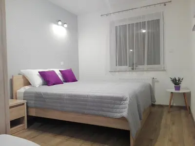 Łóżko lub łóżka w pokoju w obiekcie Apartament Marzenie 5 - Opole