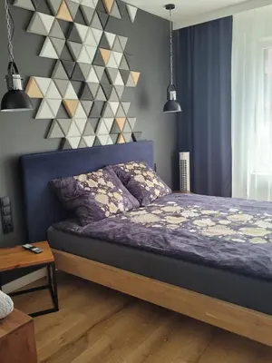 Łóżko lub łóżka w pokoju w obiekcie Apartament Małopanewska Wrocław Centrum