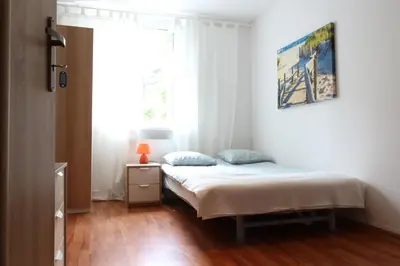 Łóżko lub łóżka w pokoju w obiekcie City Apartments & Gym