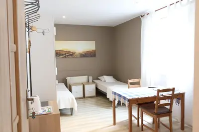Łóżko lub łóżka w pokoju w obiekcie City Apartments & Gym