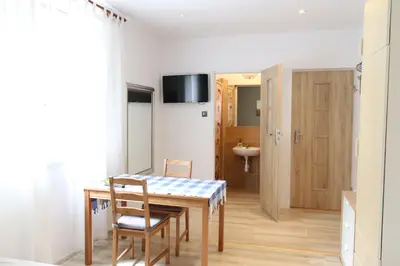 Telewizja i/lub zestaw kina domowego w obiekcie City Apartments & Gym