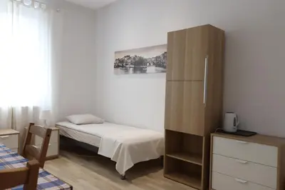 Łóżko lub łóżka w pokoju w obiekcie City Apartments & Gym