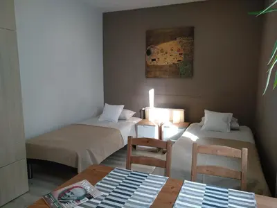 Łóżko lub łóżka w pokoju w obiekcie City Apartments & Gym