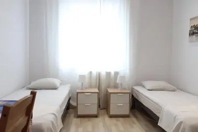 Łóżko lub łóżka w pokoju w obiekcie City Apartments & Gym