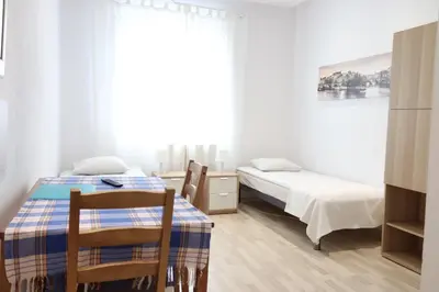 Łóżko lub łóżka w pokoju w obiekcie City Apartments & Gym