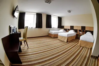 Łóżko lub łóżka w pokoju w obiekcie Boutique Hotel's Kwiska - Legnicka