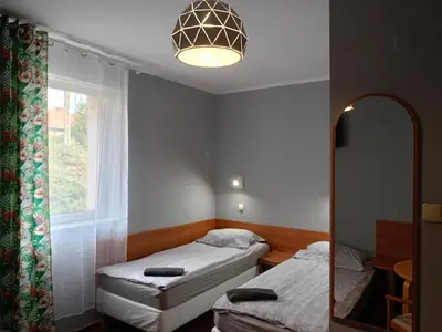 Łóżko lub łóżka w pokoju w obiekcie ZAJAZD Wałbrzych