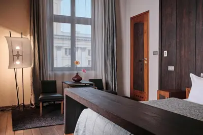 Łóżko lub łóżka w pokoju w obiekcie Hotel Monopol