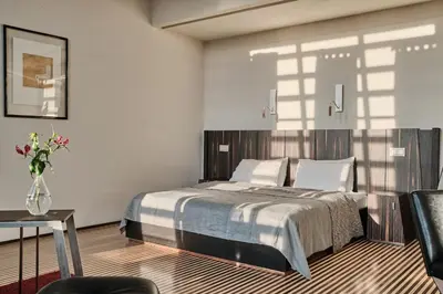 Łóżko lub łóżka w pokoju w obiekcie Hotel Monopol
