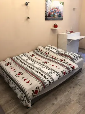 Łóżko lub łóżka w pokoju w obiekcie STUDIO FLAT Grunwaldzka up to 2persons+1