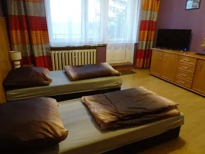 Łóżko lub łóżka w pokoju w obiekcie GOŚCINIEC AGROZAJAZD