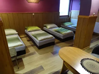 Łóżko lub łóżka w pokoju w obiekcie GOŚCINIEC AGROZAJAZD