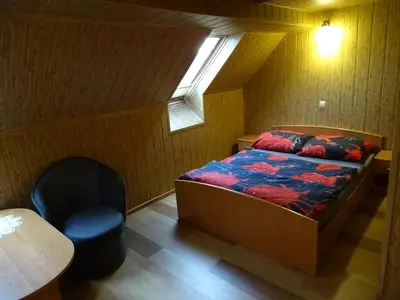 Łóżko lub łóżka w pokoju w obiekcie GOŚCINIEC AGROZAJAZD