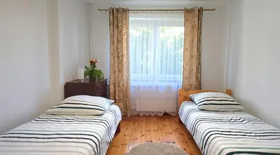 Łóżko lub łóżka w pokoju w obiekcie Silence Villa