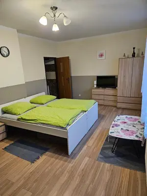 Łóżko lub łóżka w pokoju w obiekcie Gościniec w Starym Młynie