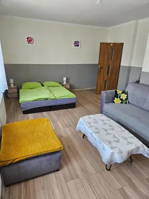 Łóżko lub łóżka w pokoju w obiekcie Gościniec w Starym Młynie