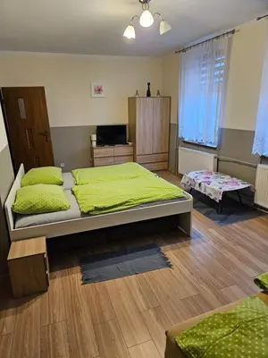 Łóżko lub łóżka w pokoju w obiekcie Gościniec w Starym Młynie