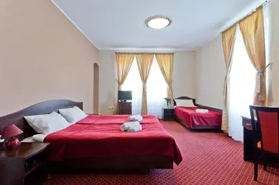 Łóżko lub łóżka w pokoju w obiekcie Pałac Pawłowice