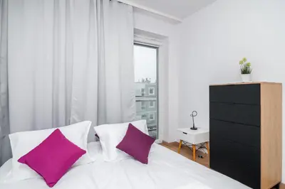Łóżko lub łóżka w pokoju w obiekcie Wrocław Rose Apartments by Noclegi Renters