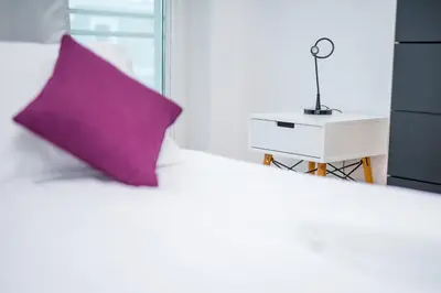 Łóżko lub łóżka w pokoju w obiekcie Wrocław Rose Apartments by Noclegi Renters