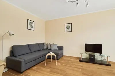 Telewizja i/lub zestaw kina domowego w obiekcie Wrocław Rose Apartments by Noclegi Renters