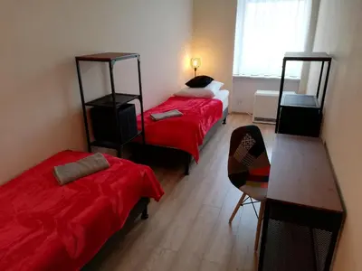 Łóżko lub łóżka w pokoju w obiekcie Apartament Miarki