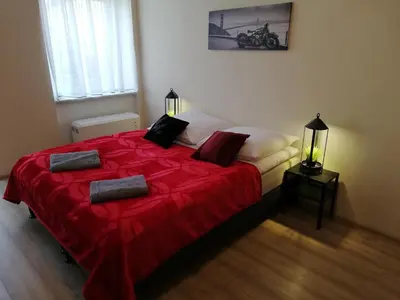 Łóżko lub łóżka w pokoju w obiekcie Apartament Miarki