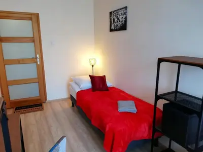 Łóżko lub łóżka w pokoju w obiekcie Apartament Miarki