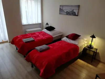 Łóżko lub łóżka w pokoju w obiekcie Apartament Miarki