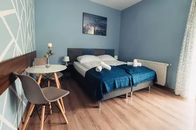 Łóżko lub łóżka w pokoju w obiekcie Villa Sudecka