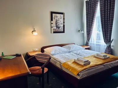 Łóżko lub łóżka w pokoju w obiekcie Park Hotel