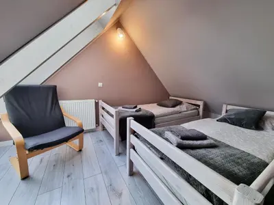 Łóżko lub łóżka w pokoju w obiekcie Domek pod świerkami
