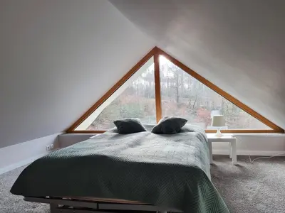 Łóżko lub łóżka w pokoju w obiekcie Domek pod świerkami