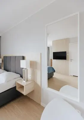 Łóżko lub łóżka w pokoju w obiekcie Q19 Apartments Rynek